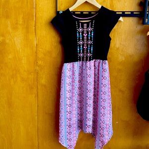 Black top with multicolor and designs bottom